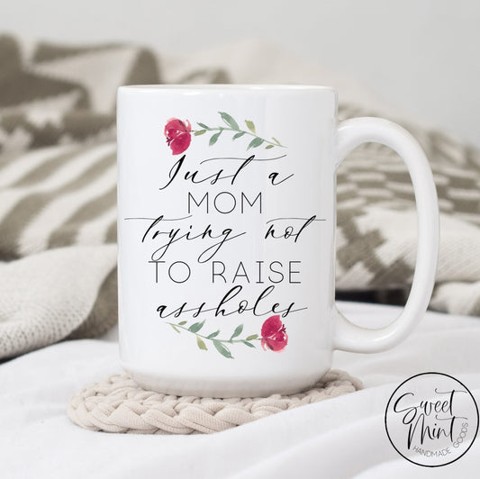 Just A Mom Trying Not To Raise Assholes Mug